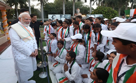 Prime Minister Narendra Modi shares a happy moment with young minds. 